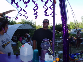from behind the purple stand